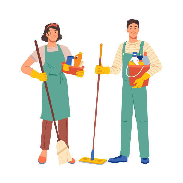 a man and woman standing  wearing aprons holding a mop and broom with other cleaning supplies
